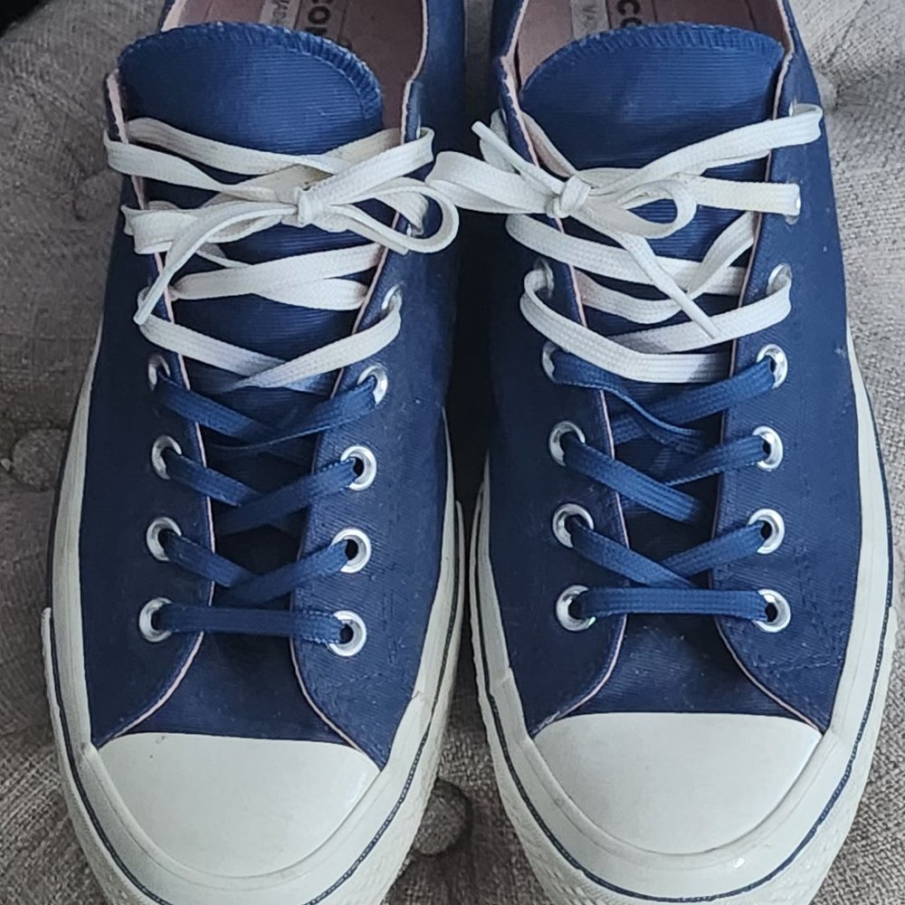 Converse All Stars Chuck Taylor Blue and White Low Top w/ blue and white laces.